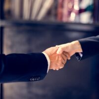 Close up of business people handshake